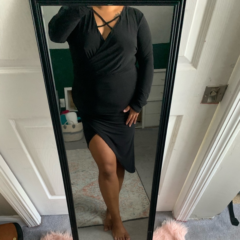 Long sleeve black dress with an asymmetric cut